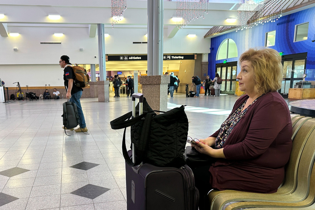 Rosie Leal sits at El Paso International Airport, Wednesday, Feb. 11, 2026, in El Paso, Texas. (AP Photo/Morgan Lee)