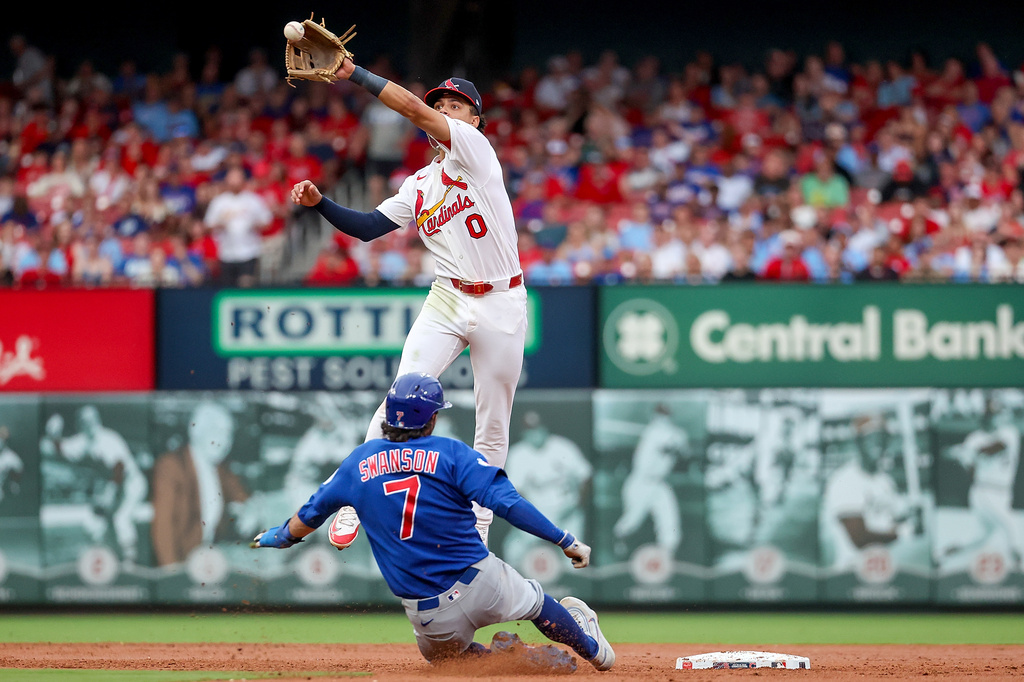 Chicago Cubs' Dansby Swanson (7) is safe at second as St. Louis Cardinals' Masyn Winn leaps for the ball during the third inning of a baseball game Sunday, May 31, 2026, in St. Louis. (AP Photo/Scott Kane)