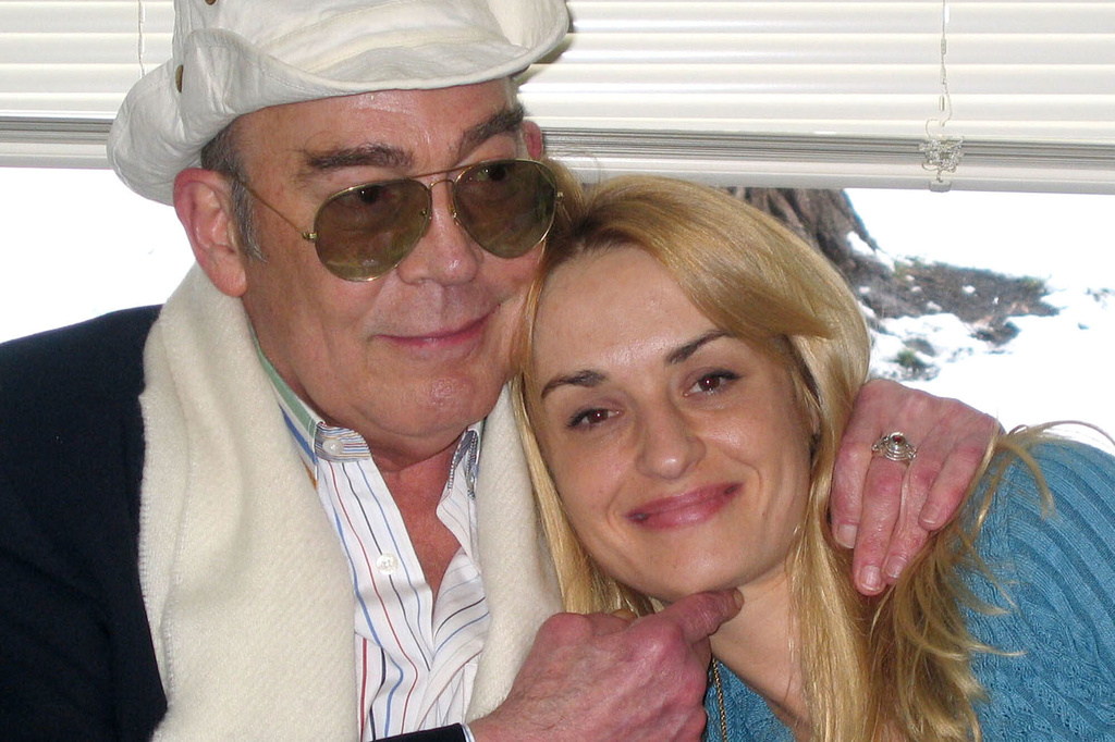 FILE - Journalist Hunter S. Thompson, left, and his wife, Anita Thompson, right, are shown at the Pitkin County Court House during their civil wedding ceremony April 23, 2003, in Aspen, Colo. (AP Photo/Louisa Davidson, File)