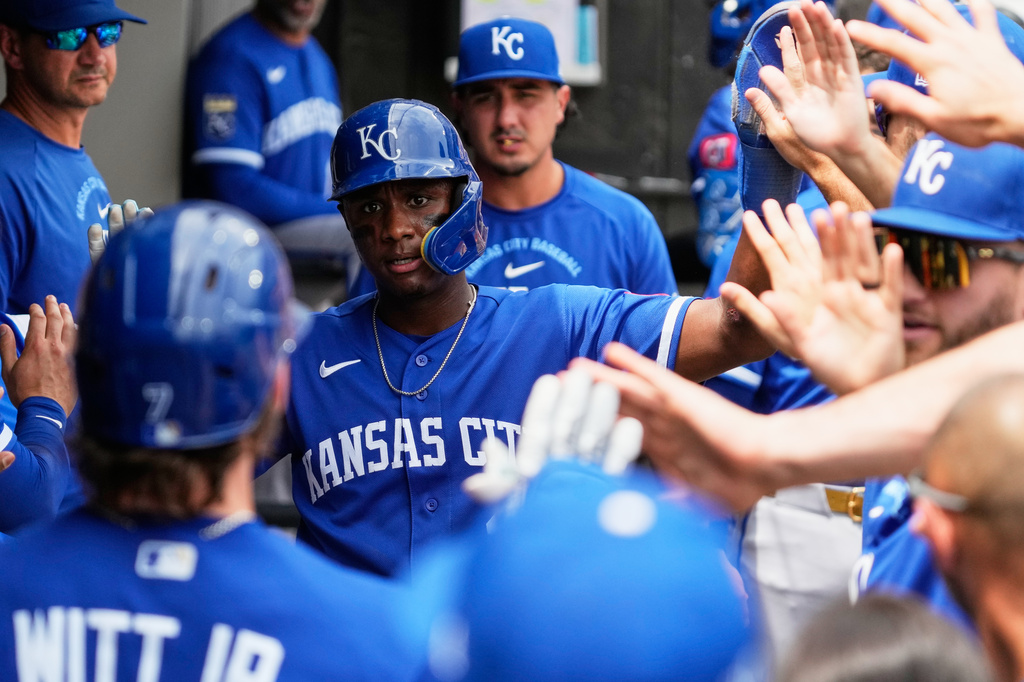 Kansas City Royals' Tyler Tolbert, center, celebrates with teammates after scoring on a sacrifice fly by Bobby Witt Jr. during the second inning of a baseball game against the Chicago White Sox in Chicago, Sunday, June 28, 2026. (AP Photo/Nam Y. Huh)
