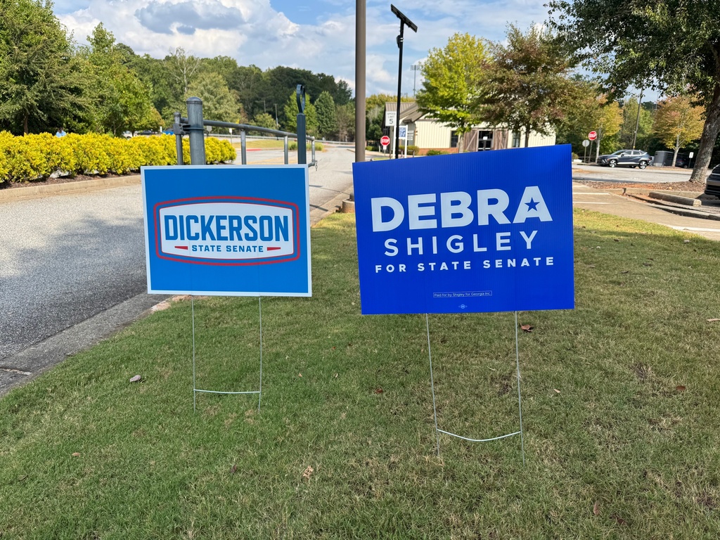Campaign signs for Georgia's Senate District 21 race are displayed, Tuesday, Sept. 23, 2025, in Milton, Ga. (AP Photo/Charlotte Kramon)