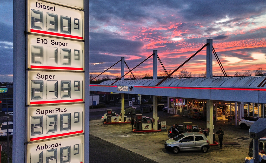 The sun has set behind a gas station in Frankfurt, Germany, Tuesday, March 31, 2026. (AP Photo/Michael Probst)