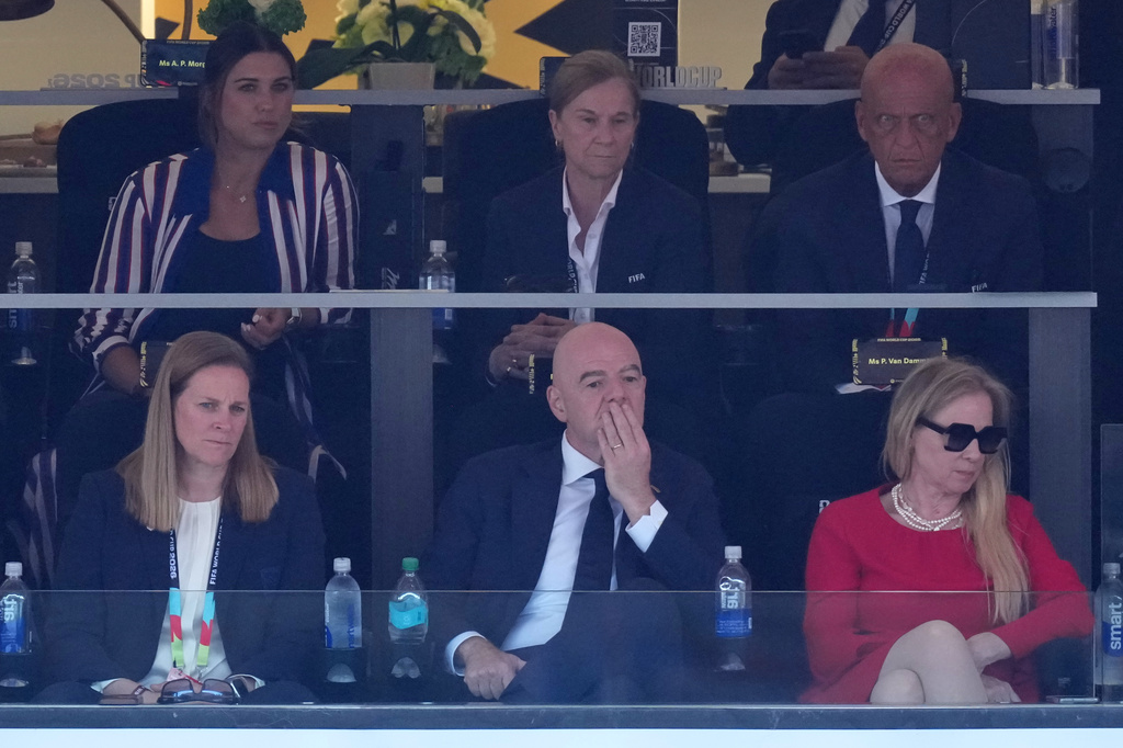 FIFA President Gianni Infantino, front center, sits with U.S. Soccer Federation President Cindy Parlow Cone, left, and Pascale Van Damme during the World Cup round of 16 soccer match between the United States and Belgium in Seattle, Monday, July 6, 2026. Top row, from left, former U.S. soccer player Alex Morgan, former U.S. women's national team coach Jill Ellis, and former referee Pierluigi Collina watch. (AP Photo/Nick Didlick)