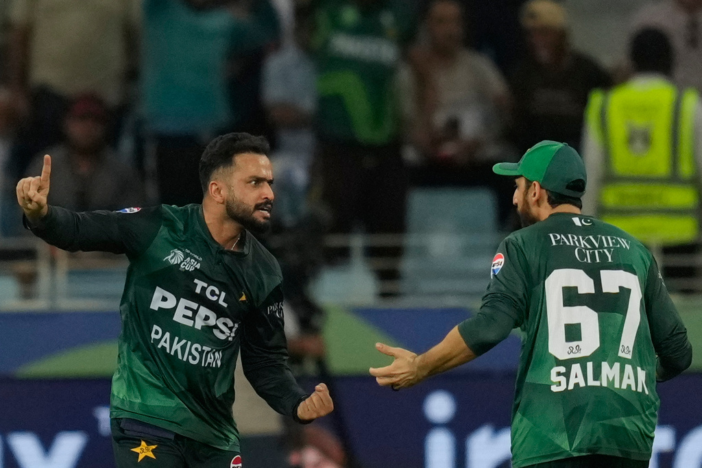 Pakistan's Mohammad Nawaz, left, celebrates with Pakistan's captain Salman Agha after the dismissal of Bangladesh's Mehedi Hasan during the Asia Cup cricket match between Bangladesh and Pakistan at Dubai International Cricket stadium in Dubai, United Arab Emirates, Thursday, Sept. 25, 2025. (AP Photo/Altaf Qadri)