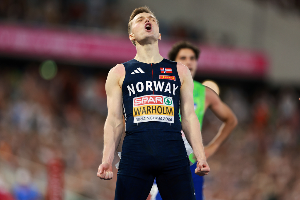 Karsten Warholm of Norway celebrates winning the men's 400 meters hurdles final at the European Athletics Championships in Birmingham, England, Friday, Aug. 14, 2026. (AP Photo/Morgan Harlow)