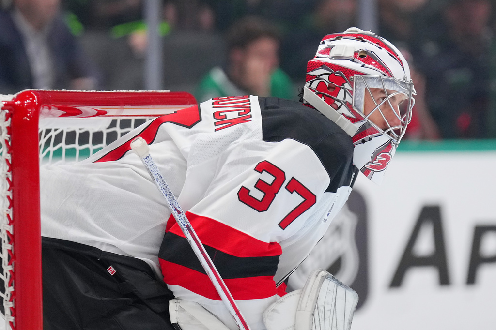 New Jersey Devils goaltender Connor Hellebuyck defends his net during the first period of an NHL hockey game against the Dallas Stars, Tuesday, Oct. 27, 2026, in Dallas. (AP Photo/Julio Cortez)