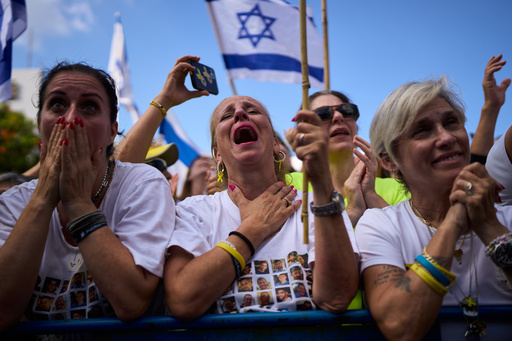 People react as they watch a live broadcast of Israeli hostages released from Hamas captivity in the Gaza Strip, at a plaza known as hostages square in Tel Aviv, Israel, Monday, Oct. 13, 2025. (AP Photo/Oded Balilty) People react as they watch a live broadcast of Israeli hostages released from Hamas captivity in the Gaza Strip, at a plaza known as hostages square in Tel Aviv, Israel, Monday, Oct. 13, 2025. (AP Photo/Oded Balilty)