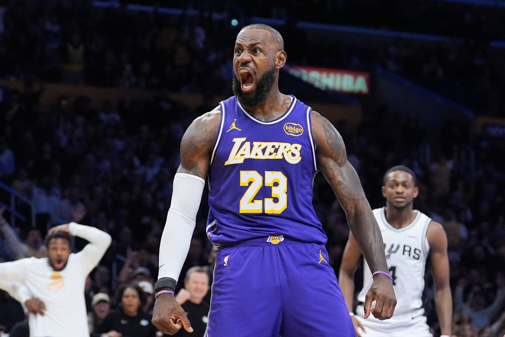 Los Angeles Lakers forward Lebron James (23) reacts after making a dunk during the first half of an NBA Cup basketball game against the San Antonio Spurs Wednesday, Dec. 10, 2025, in Los Angeles. (AP Photo/Jae C. Hong)