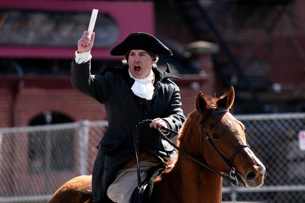 Brig. Gen. Richard Reale, dressed as American patriot Paul Revere reenacts the 1775 Boston-to-Lexington ride to alert colonists of approaching British troops, Monday, April 20, 2026, in Boston. (AP Photo/Robert F. Bukaty)