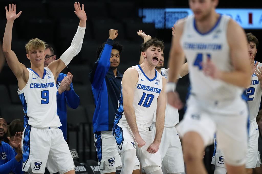 Creighton guard Ty Davis (9), guard Hudson Greer (10) and teammates celebrate a score against the Oregon during the second half of an NCAA college basketball game in the Players Era tournament in Las Vegas, Thursday, Nov. 27, 2025. (AP Photo/Eric Gay)