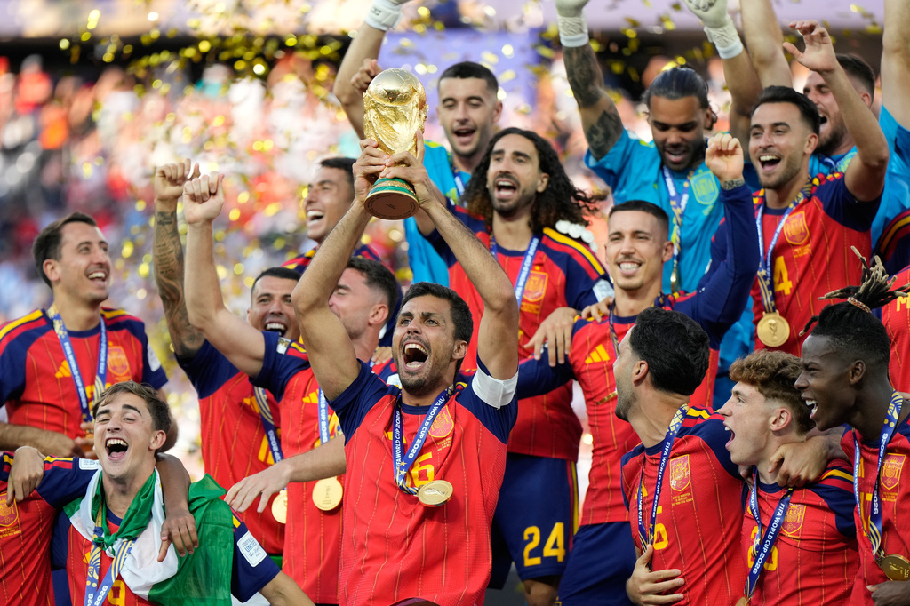 Spain's Rodri celebrates with the trophy after winning the World Cup final soccer match between Spain and Argentina in East Rutherford, N.J., near New York, Sunday, July 19, 2026. (AP Photo/Ashley Landis)