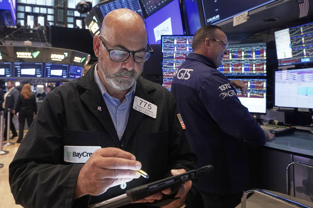 Trader Fred Fred Demarco, left, works on the floor of the New York Stock Exchange, Wednesday, Sept. 17, 2025. (AP Photo/Richard Drew)