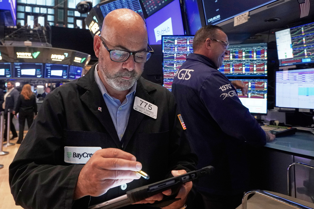 Trader Fred Fred Demarco, left, works on the floor of the New York Stock Exchange, Wednesday, Sept. 17, 2025. (AP Photo/Richard Drew)
