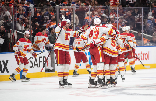 Calgary Flames celebrate their shootout win over the Edmonton Oilers in NHL action, in Edmonton on Wednesday, Oct. 8, 2025. (Jason Franson/The Canadian Press via AP) Calgary Flames celebrate their shootout win over the Edmonton Oilers in NHL action, in Edmonton on Wednesday, Oct. 8, 2025. (Jason Franson/The Canadian Press via AP)