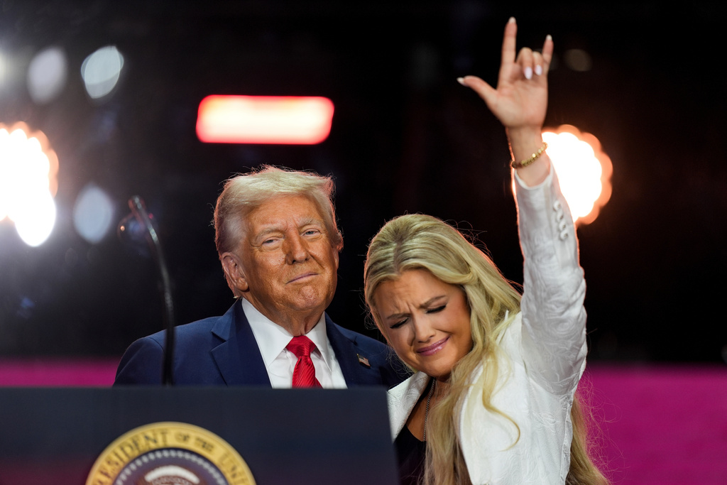 FILE - President Donald Trump stands with Erika Kirk at the conclusion of a memorial for her husband, conservative activist Charlie Kirk, in Glendale, Ariz., Sept. 21, 2025. (AP Photo/Julia Demaree Nikhinson, File)
