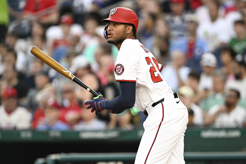 Washington Nationals' James Wood watches his single hit off Philadelphia Phillies pitcher Jesús Luzardo during the third inning of a baseball game, Thursday, Aug. 14, 2025, in Washington. (AP Photo/Terrance Williams)