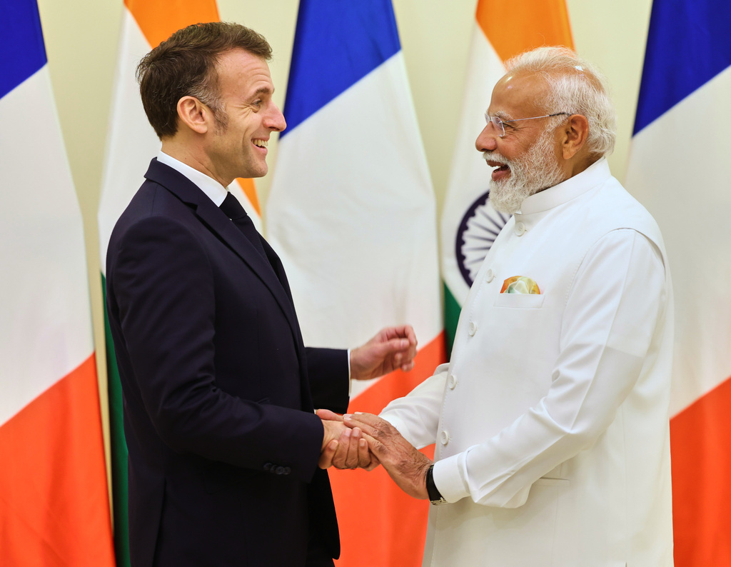 Indian Prime Minister Narendra Modi, right, welcomes French President Emmanuel Macron in Mumbai, India, Tuesday, Feb.17, 2026. (Indian Prime Minister Office via AP)