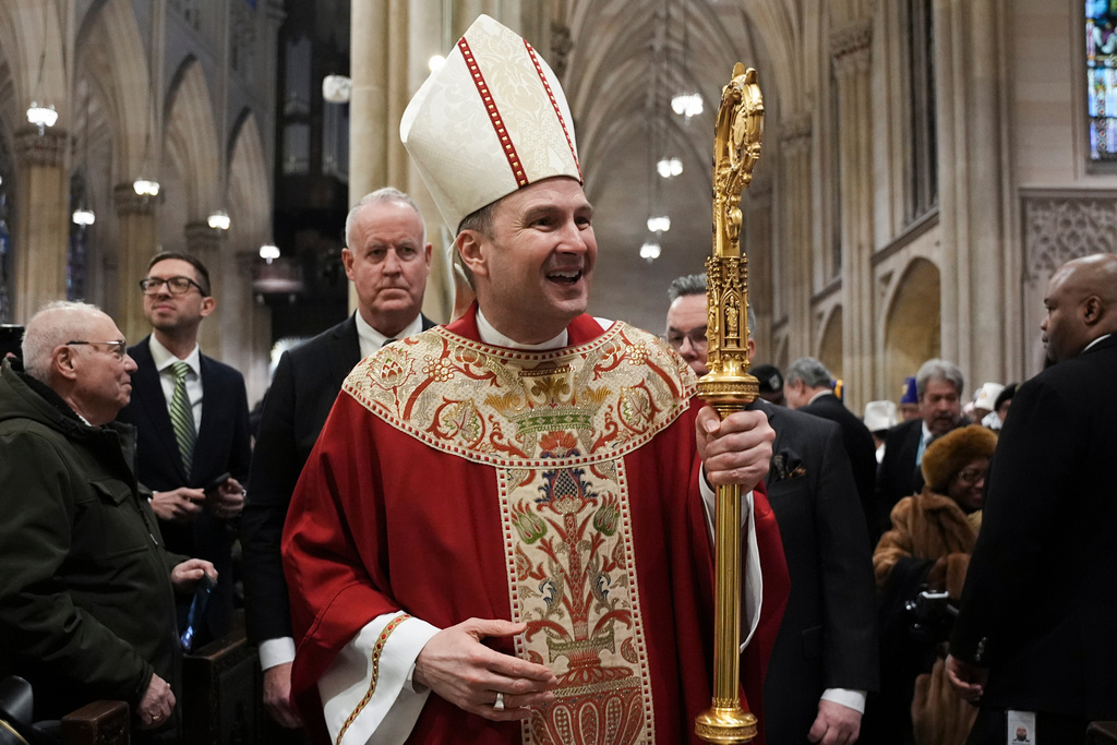 New York Archbishop-designate Ronald A. Hicks, who is taking over from Cardinal Timothy Dolan, leaves after his Installation Mass at St. Patrick's Cathedral in the Manhattan borough of New York on Friday, Feb. 6, 2026. (Angelina Katsanis/ Pool Reuters via AP)