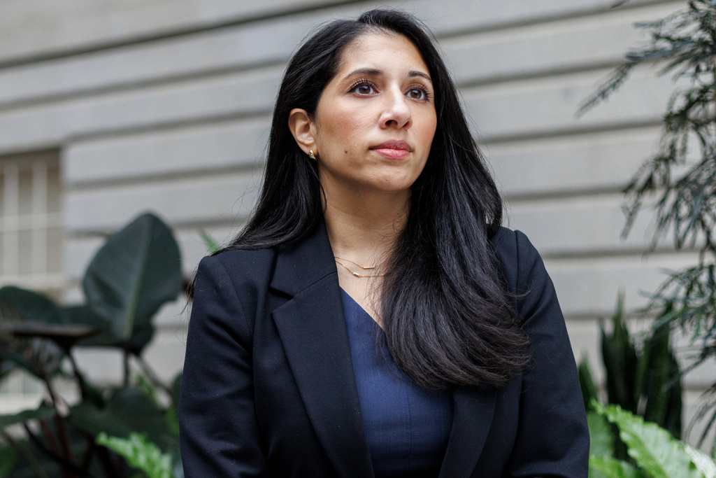 Anam Petit, a former Justice Department employee, poses for a portrait in the Robert and Arlene Kogod Courtyard at the National Portrait Gallery in Washington, Friday, Jan. 9, 2026. (AP Photo/Moriah Ratner)