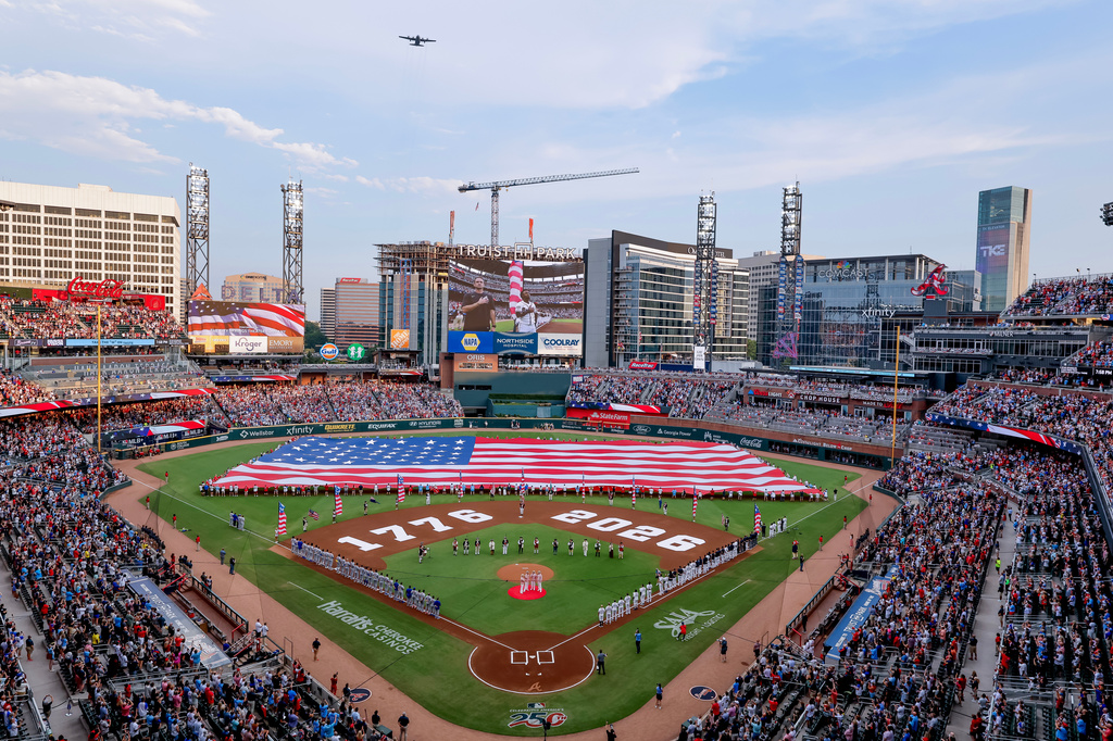 A Lockheed C-130H performs a flyover during Independence Day activities before a baseball game between the Atlanta Braves and the New York Mets, Saturday, July 4, 2026, in Atlanta. (AP Photo/Erik S. Lesser)
