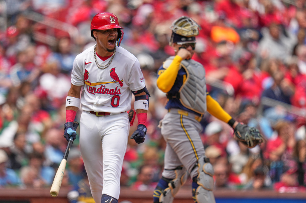 St. Louis Cardinals' Masyn Winn (0) reacts after lining out to Milwaukee Brewers third baseman David Hamilton as Brewers catcher William Contreras, right, watches during the fourth inning of a baseball game Wednesday, May 6, 2026, in St. Louis. (AP Photo/Jeff Roberson)