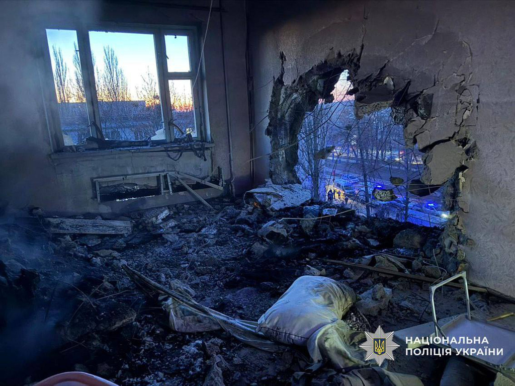 This photo provided by the Ukrainian Police Press Service shows an apartment damaged by Russian drone during air attack in Chernyhiv, Ukraine, on Christmas Eve, Wednesday, Dec. 24, 2025. (Ukrainian Police Press Service via AP)