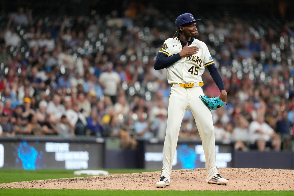 Milwaukee Brewers' Abner Uribe gestures during the eighth inning of a baseball game against the St. Louis Cardinals, Tuesday, May 26, 2026, in Milwaukee. (AP Photo/Aaron Gash)