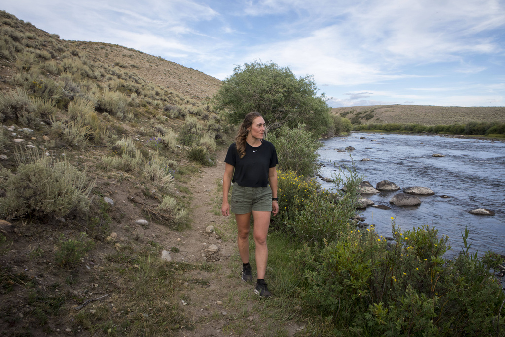 Heather Sterling hikes along the Green River, Aug. 11, 2025, near Daniel, Wyo. (AP Photo/Amber Baesler)