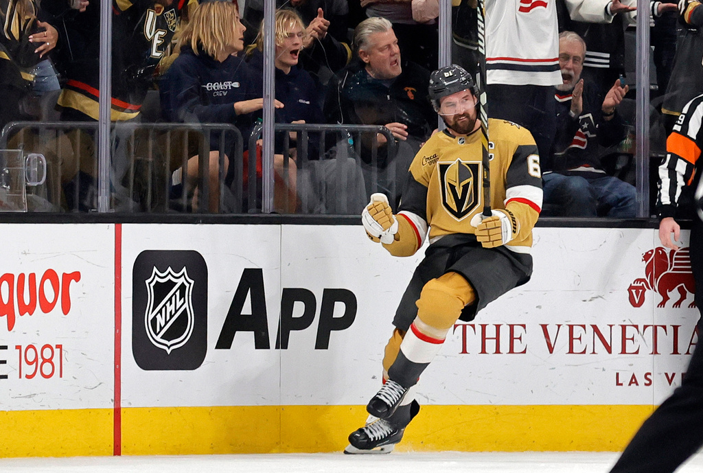Vegas Golden Knights right wing Mark Stone (61) celebrates after scoring against the San Jose Sharks during the first period of an NHL hockey game Tuesday, Dec. 23, 2025, in Las Vegas. (AP Photo/Steve Marcus)