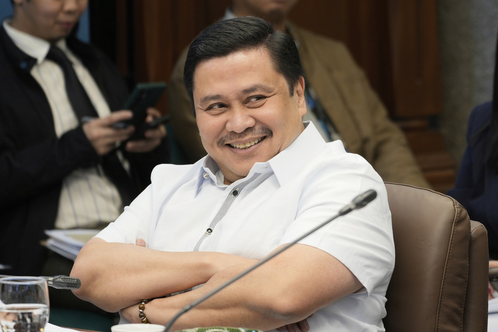 Senator Jinggoy Estrada smiles during a break in investigations on flood-control projects at the Senate Blue Ribbon committee in Pasay city, Philippines on Monday, Sept. 8, 2025. (AP Photo/Aaron Favila)