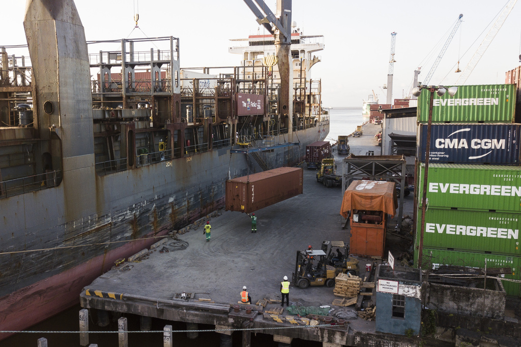A container is loaded onto a cargo ship a day ahead of general elections in Georgetown, Guyana, Sunday, Aug. 31, 2025. (AP Photo/Matias Delacroix)