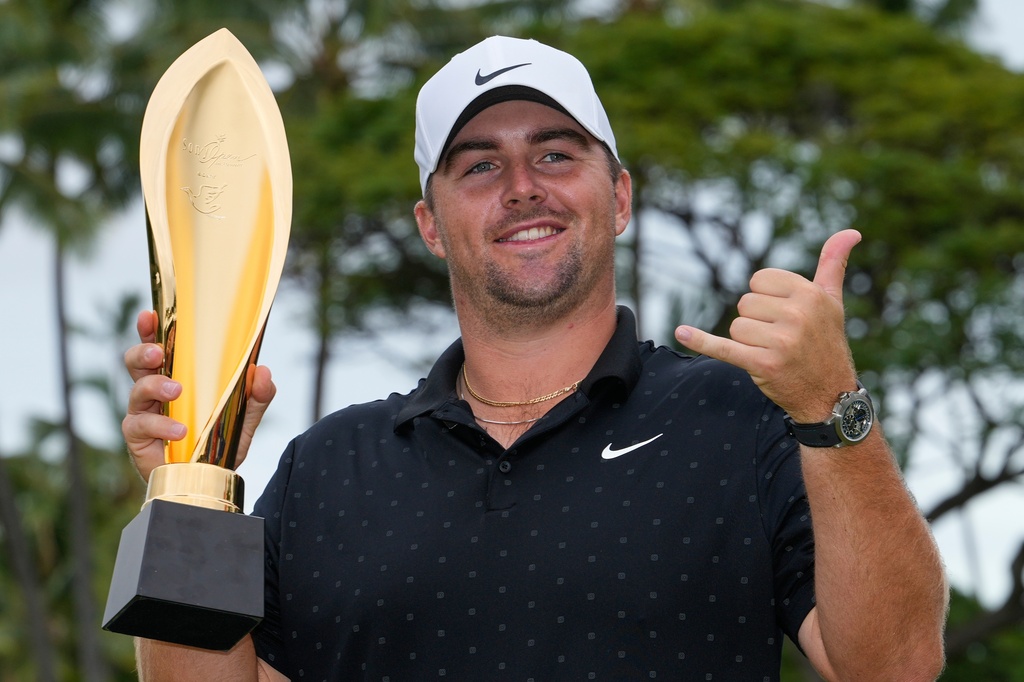 Chris Gotterup holds his trophy after winning the Sony Open golf event at the Waialae Country Club in Honolulu, Sunday, Jan. 18, 2026. (AP Photo/Matt York)