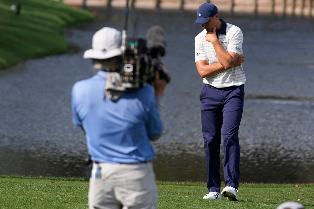 Ludvig Aberg of Sweden, reacts to his ball hitting the water on the 12th hole during the final round of The Players Championship golf tournament, Sunday, March 15, 2026, in Ponte Vedra Beach, Fla. (AP Photo/Gerald Herbert)