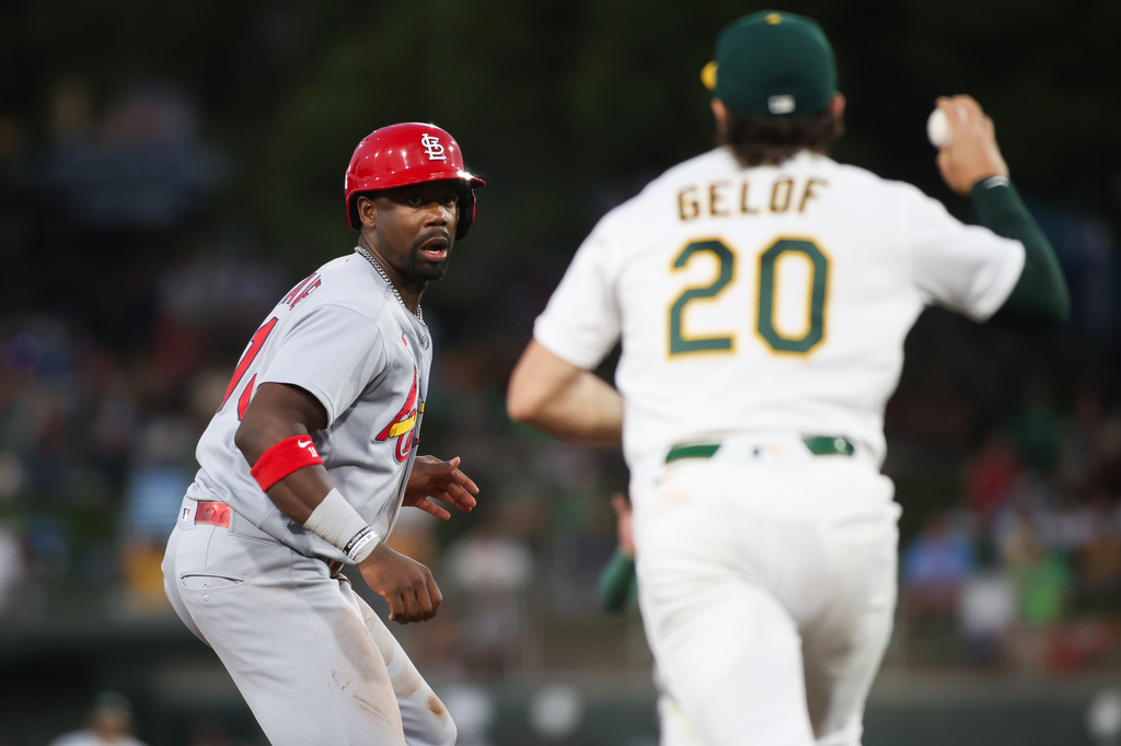 St. Louis Cardinals' Jordan Walker, left, is caught in a run down during the fifth inning of a baseball game against the Athletics Tuesday, May 12, 2026, in West Sacramento, Calif. (AP Photo/Scott Marshall)