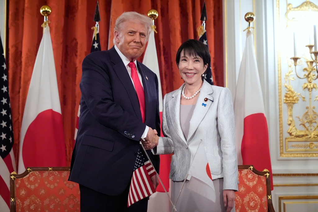 President Donald Trump, left, and Japan's Prime Minister Sanae Takaichi shake hands during a signing ceremony at Akasaka Palace in Tokyo, Japan, Tuesday, Oct. 28, 2025. (AP Photo/Mark Schiefelbein)