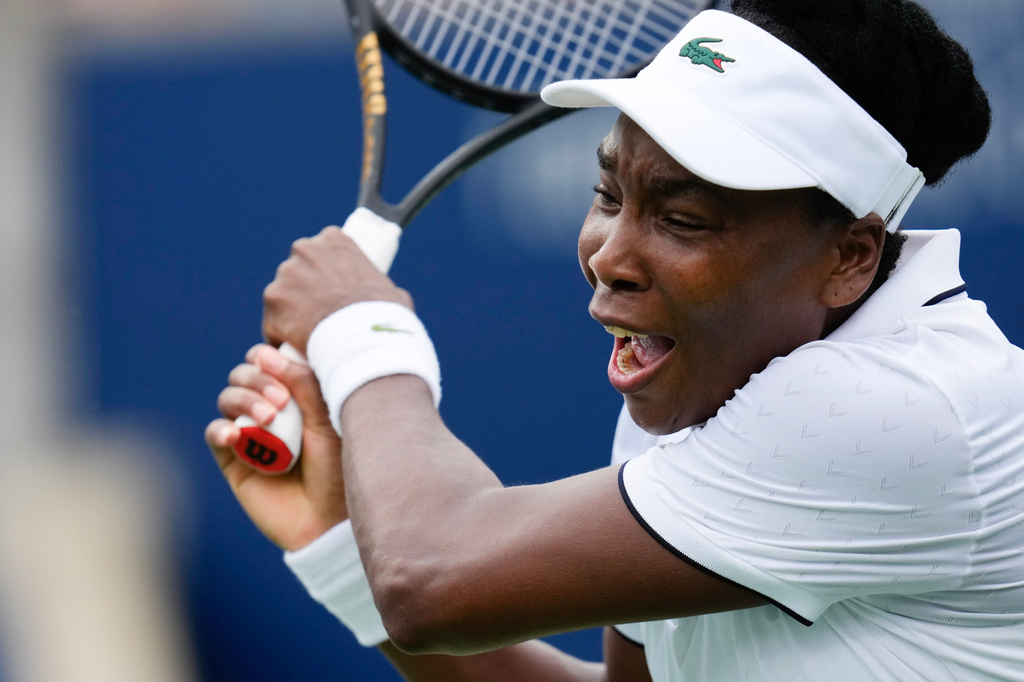 Venus Williams plays a return against Kamilla Rakhimova during the National Bank Open tennis tournament in Toronto, Sunday, Aug. 2, 2026. (Chris Young/The Canadian Press via AP)
