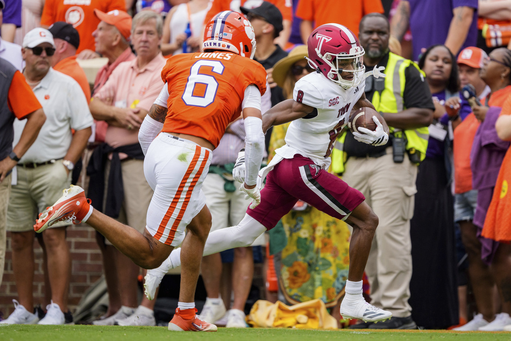 Troy wide receiver Tray Taylor, right, runs for a touchdown after a reception while pursued by Clemson safety Ricardo Jones (6) in the first half of an NCAA college football game Saturday, Sept. 6, 2025, in Clemson, S.C. (AP Photo/Jacob Kupferman)