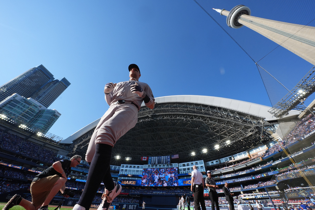New York Yankees outfielder Aaron Judge heads to the dugout before Game 2 of baseball's American League Division Series against the Toronto Blue Jays in Toronto, Sunday, Oct. 5, 2025. (Frank Gunn/The Canadian Press via AP)