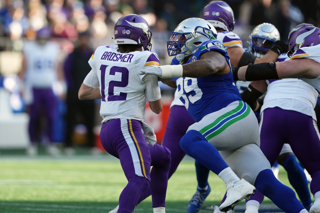 Seattle Seahawks defensive end Leonard Williams (99) sacks Minnesota Vikings quarterback Max Brosmer (12) during the first half of an NFL football game Sunday, Nov. 30, 2025, in Seattle. (AP Photo/Lindsey Wasson)