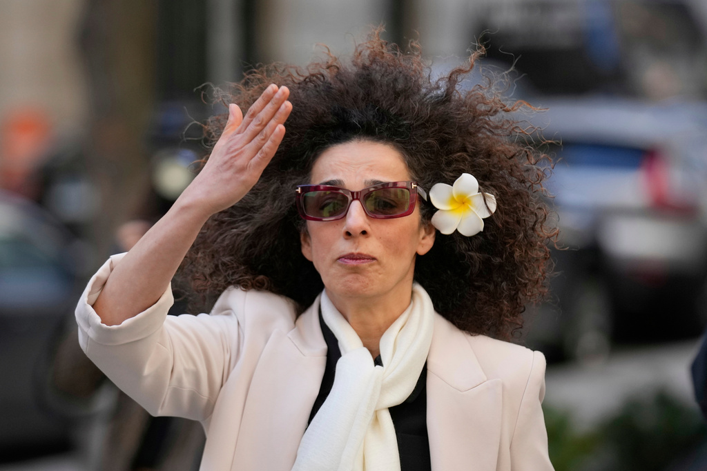 FILE - Masih Alinejad blows a kiss to supporters outside the federal courthouse after testifying at the trial of her would-be assassins in New York, March 18, 2025. (AP Photo/Seth Wenig, File)