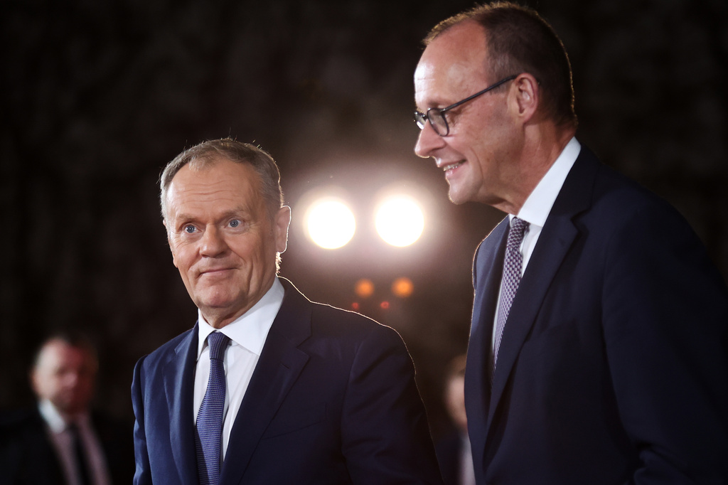 FILE - German Chancellor Friedrich Merz welcomes Polish Prime Minister Donald Tusk at the Chancellery in Berlin on Dec. 15, 2025. (AP Photo/Maryam Majd, File)
