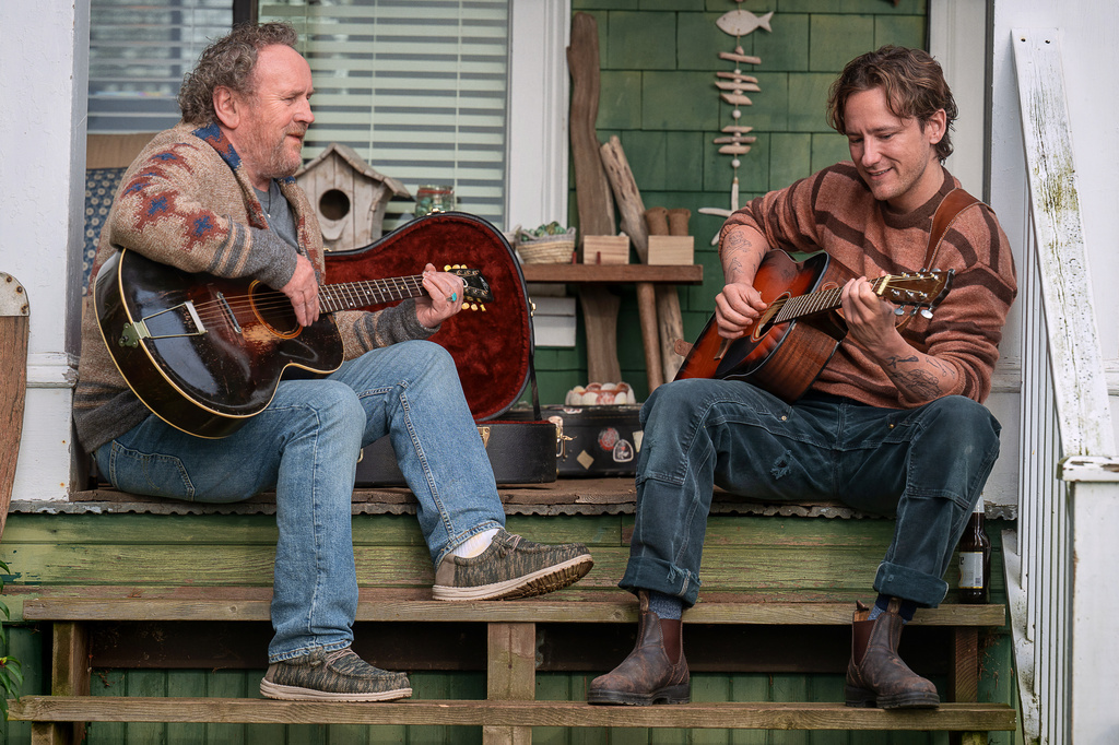 This image released by Netflix shows Colm Meaney, left, and Lewis Pullman in a scene from "Remarkably Bright Creatures." (Netflix via AP)