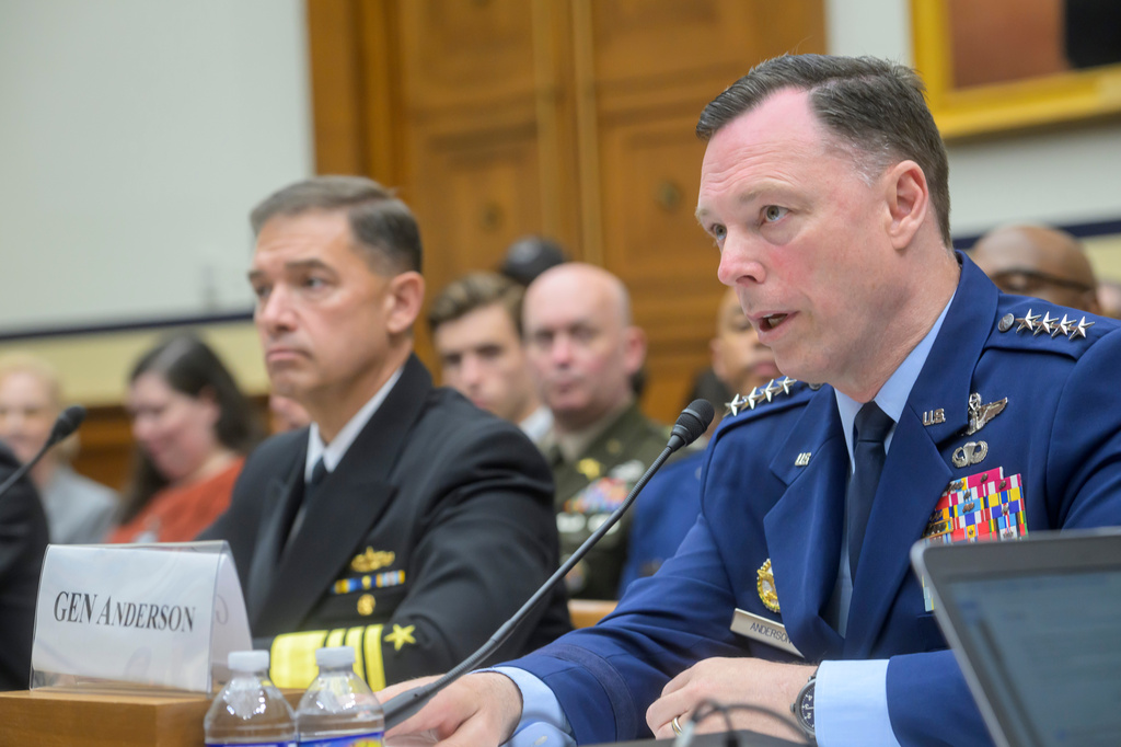 General Dagvin Anderson, USAF, Commander, U.S. Africa Command, right, is joined by Admiral Brad Cooper, USN, Commander, U.S. Central Command, left, during a House Committee on Armed Services business meeting on the U.S. Military Posture and National Security Challenges in the Greater Middle East and Africa, on Capitol Hill, Tuesday, May 19, 2026, in Washington. (AP Photo/Rod Lamkey, Jr.)
