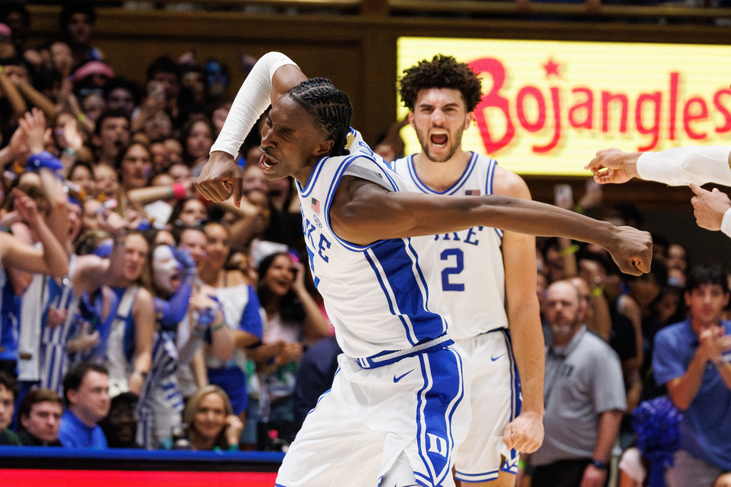 Duke's Dame Sarr, left, and Duke's Cameron Boozer, right, celebrate after a play during the second half of an NCAA college basketball game against North Carolina in Durham, N.C., Saturday, March 7, 2026. (AP Photo/Ben McKeown)