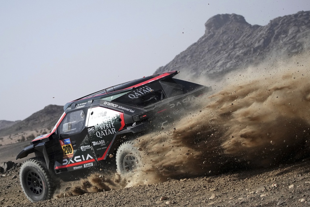 Driver Nasser Al-Attiyah and co-driver Edouard Boulanger compete during the prologue of the Dakar Rally in Bisha, Saudi Arabia, Friday, Jan. 3, 2025. (AP Photo/Christophe Ena)
