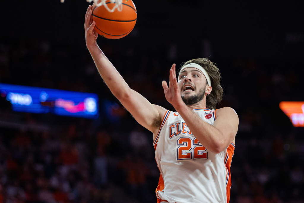 Clemson center Carter Welling (22) lays up against North Carolina State during the first half of an NCAA college basketball game Tuesday, Jan. 20, 2026, in Clemson, S.C. (AP Photo/Scott Kinser)