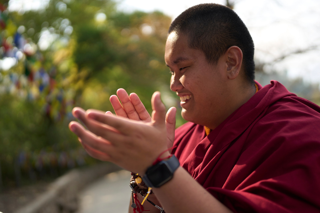 Jalue Dorje laughs with his mother during a visit to Maratika Caves, in eastern Nepal, Monday, April 13, 2026. (AP Photo/Niranjan Shrestha)