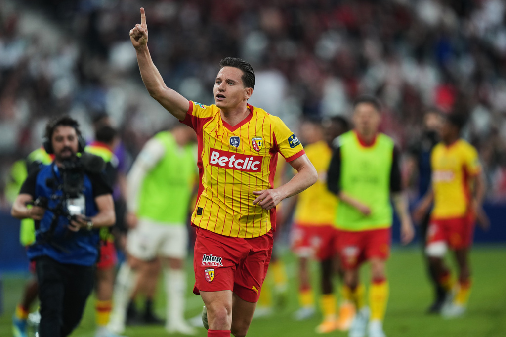 FILE - Lens' Florian Thauvin celebrates after scoring during the French Cup soccer final between Nice and Lens in Saint-Denis, outside Paris, Friday, May 22, 2026. (AP Photo/Thibault Camus, file)