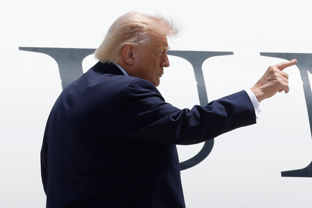President Donald Trump gestures from the stairs of Air Force One upon his arrival at Joint Base Andrews, Md., Friday, June 5, 2026.(AP Photo/Luis M. Alvarez)