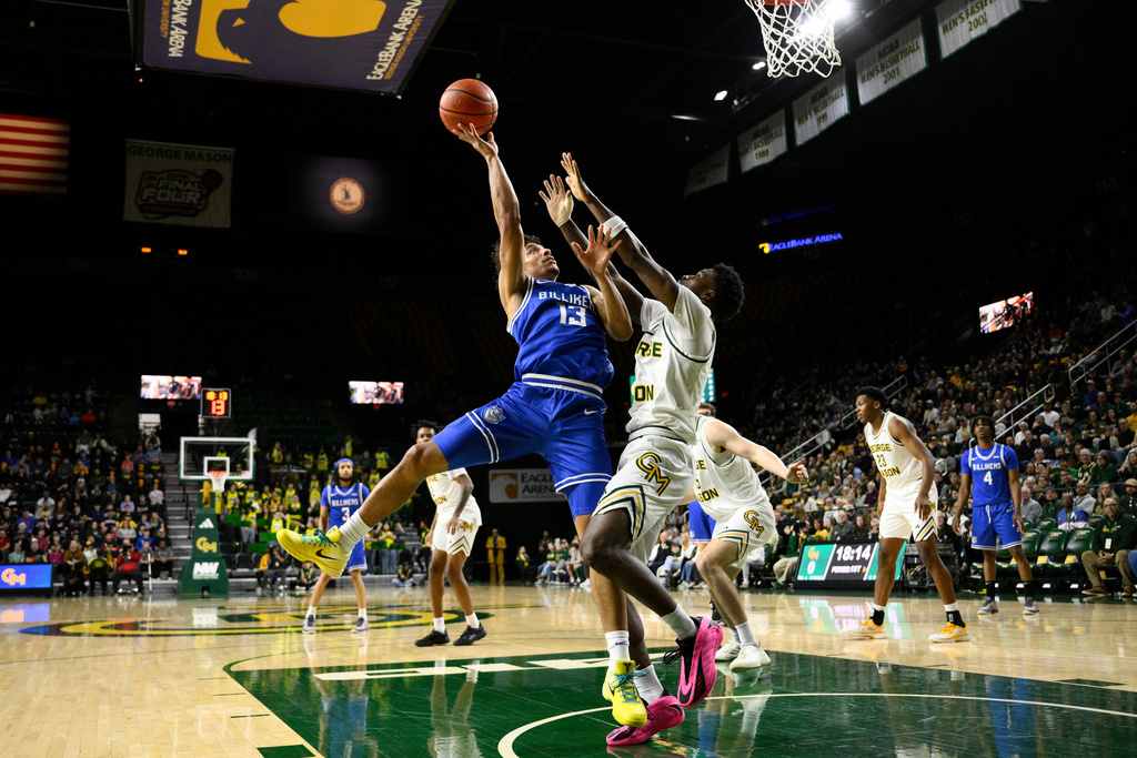 Saint Louis guard Dion Brown (13) shoots against George Mason guard Kory Mincy (3) during the first half of an NCAA college asketball game, Saturday, March 7, 2026, in Fairfax, Va. (AP Photo/Nick Wass)